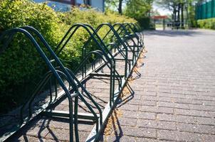 Bicycle parking in the city, outdoors, on a spring day. Concept of an active lifestyle. photo