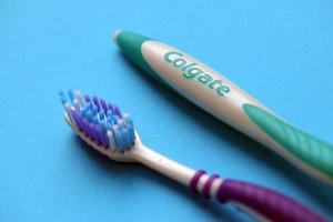 TERNOPIL, UKRAINE - JUNE 23, 2022 Colgate toothbrushes, a brand of oral hygiene products manufactured by American consumer-goods company Colgate-Palmolive photo