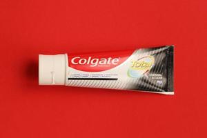 TERNOPIL, UKRAINE - JUNE 23, 2022 Colgate toothpaste, a brand of oral hygiene products manufactured by American consumer-goods company Colgate-Palmolive photo