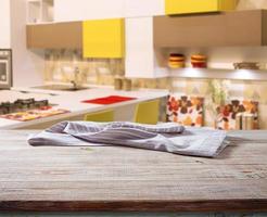 White napkin, table cloth on wooden deck mockup. Kitchen interior background photo