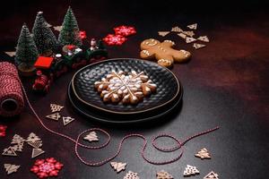 Home festive Christmas table decorated by toys and gingerbreads photo