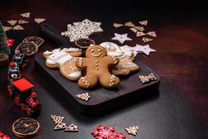 Home festive Christmas table decorated by toys and gingerbreads photo