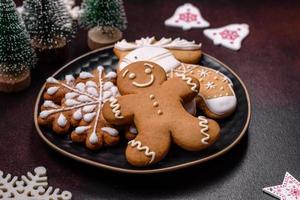 Home festive Christmas table decorated by toys and gingerbreads photo