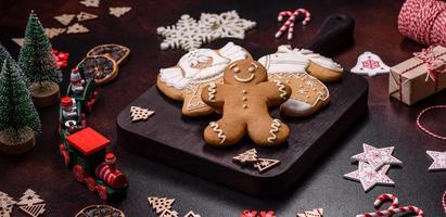 Home festive Christmas table decorated by toys and gingerbreads photo