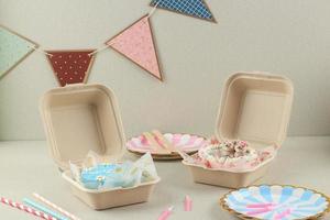 Bento Cakes,  Small Cake in a Lunchboxes on a Cream Concrete Background. photo