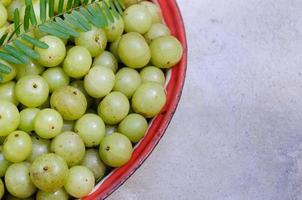 Fresh Organic Indian Gooseberry or Emblic Fruit photo
