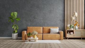 Living room interior with orange leather sofa in loft style house on concrete wall background.