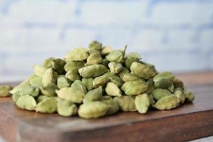 close up of Cardamom on a chopping board photo