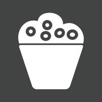 icono de glifo de cupcake invertido vector