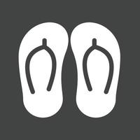 zapatillas glifo icono invertido vector