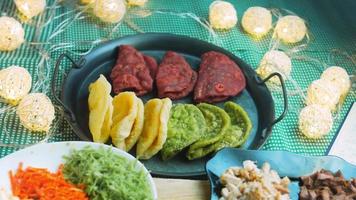 Tortillas prepared and decorated with spinach and beets. Red and green tortillas