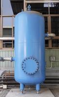 Blue chemical tank in industrial plant photo