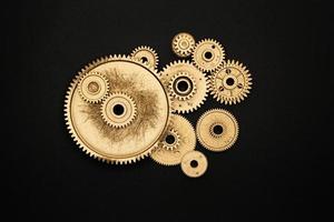 golden gears on black background photo