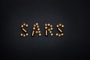 sars word on black background photo