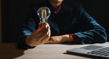Innovation. Hands holding light bulb for Concept new idea concept with innovation and inspiration, innovative technology in science and communication concept, photo