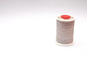Gray spools placed on a white background. photo
