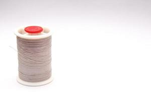 Gray spools placed on a white background. photo