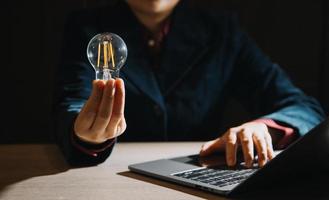 Innovation. Hands holding light bulb for Concept new idea concept with innovation and inspiration, innovative technology in science and communication concept, photo