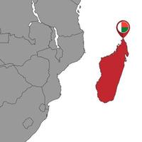pin mapa con la bandera de madagascar en el mapa mundial. ilustración vectorial vector