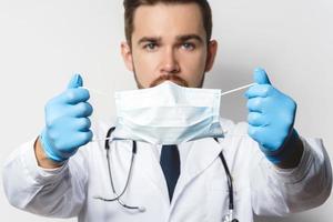 Doctor is wearing prevention mask against virus spreading photo