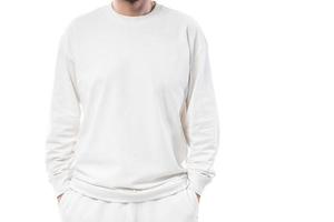 Man wearing white long-sleeved t-shirt with empty space for design photo