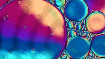 Abstract Colorful Food Oil Drops Bubbles and spheres Flowing on Water Surface photo