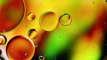 Abstract Colorful Food Oil Drops Bubbles and spheres Flowing on Water Surface photo