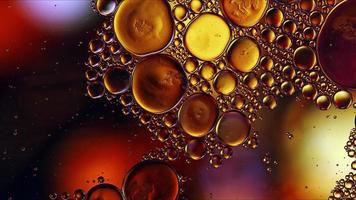 Abstract Colorful Food Oil Drops Bubbles and spheres Flowing on Water Surface photo