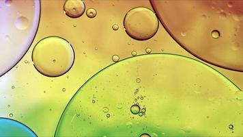 Abstract Colorful Food Oil Drops Bubbles and spheres Flowing on Water Surface photo