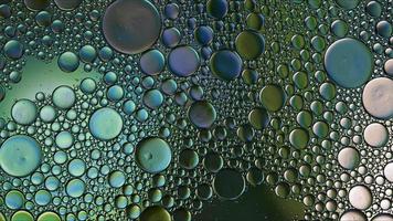 Abstract Colorful Food Oil Drops Bubbles and spheres Flowing on Water Surface photo