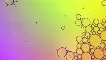 Abstract Colorful Food Oil Drops Bubbles and spheres Flowing on Water Surface photo