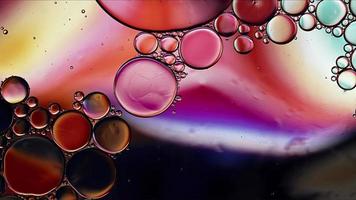 Abstract Colorful Food Oil Drops Bubbles and spheres Flowing on Water Surface photo