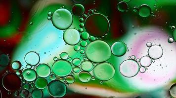 Abstract Colorful Food Oil Drops Bubbles and spheres Flowing on Water Surface photo