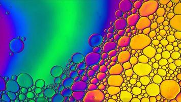 Abstract Colorful Food Oil Drops Bubbles and spheres Flowing on Water Surface photo