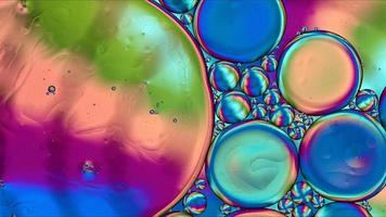 Abstract Colorful Food Oil Drops Bubbles and spheres Flowing on Water Surface photo