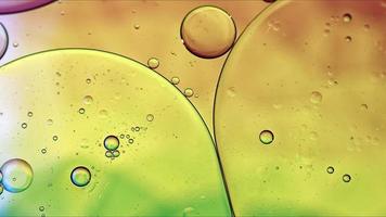 Abstract Colorful Food Oil Drops Bubbles and spheres Flowing on Water Surface photo