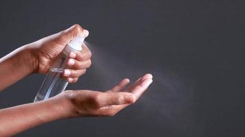 Spraying hand sanitizer into palm video