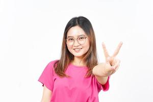 Showing Peace Sign of Beautiful Asian Woman Isolated On White Background photo