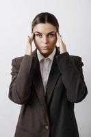 Fashionable studio portrait of young masculine woman photo