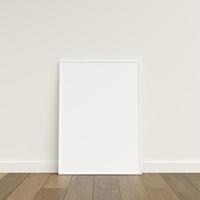 Empty picture frame on wooden floor leaning against wall. Blank poster frame standing on wooden floor. Blank poster frame mockup. Empty picture frame mockup. 3d rendering. photo