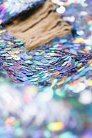 Closeup shot of a shiny multicolored sequin fabric. photo