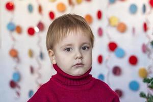 Portrait of a cute boy. Children's emotions. Christmas and new year. photo