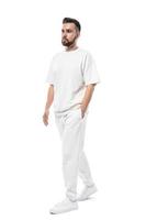 Handsome man wearing white clothes with a blank space for design on white background photo