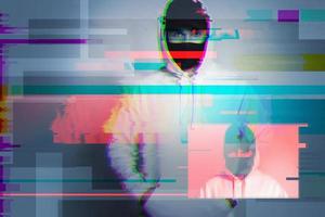 Creative image with anonymous hacker with glitch and interference effects photo