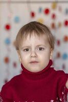 Portrait of a cute boy. Children's emotions. Christmas and new year. photo