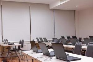 Laptop arranging rows in computer classroom photo