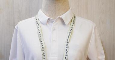 Close up mannequin with white shirt and waist measuring tape photo