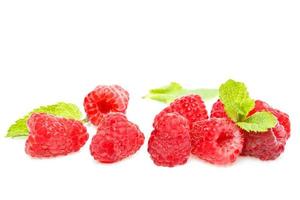 Fresh red ripe raspberries on white background photo