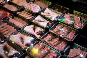 raw meat on the bench in the store photo