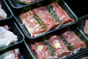 raw meat on the bench in the store photo